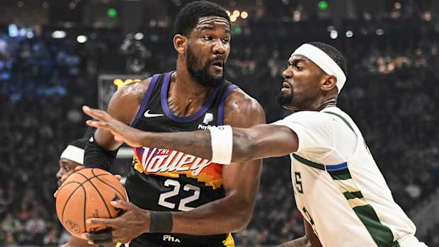 Phoenix Suns center Deandre Ayton (22) gets pressure from Milwaukee Bucks center Bobby Portis.